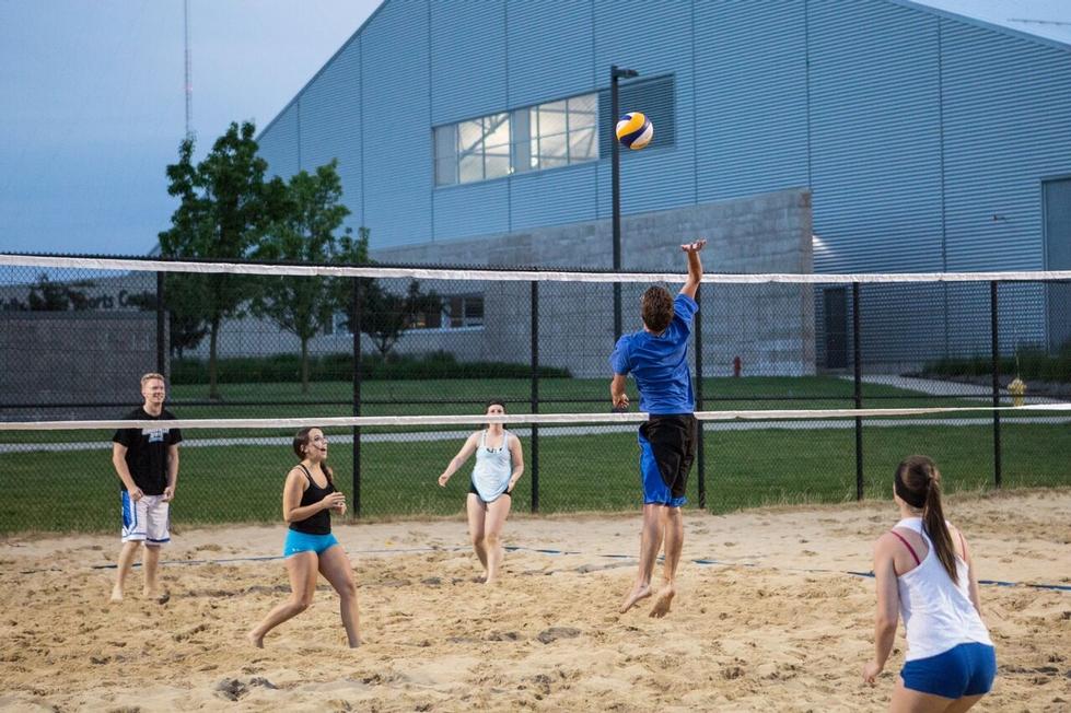 sand volleyball players playing